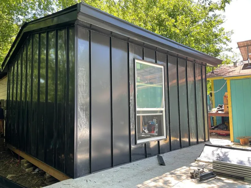 Black standing seam metal wall panels for Roof Inspection in Elk River